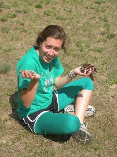 Gaby Sitting And Holding Pinecones