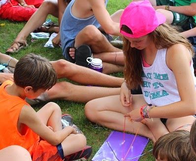 Campers making friendship bracelets