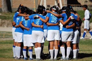 The NPH El Salvador girls varsity team huddles