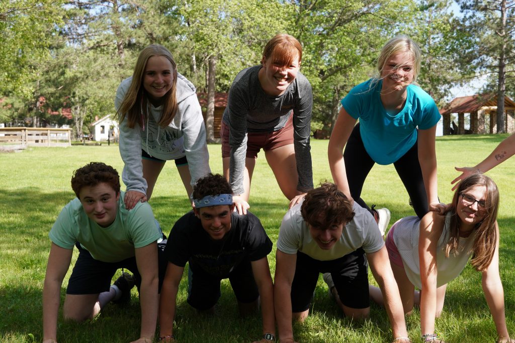 Group of campers engaging in team-building activities at Camp Foley, Minnesota