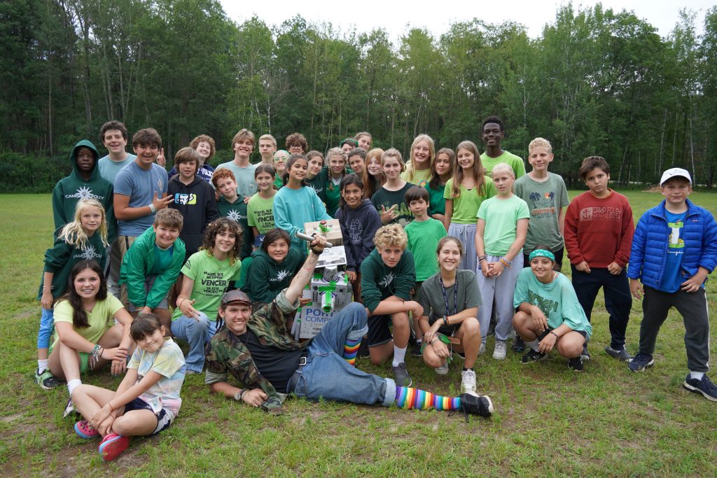 Diverse group of teenage campers engaged in coed activities
