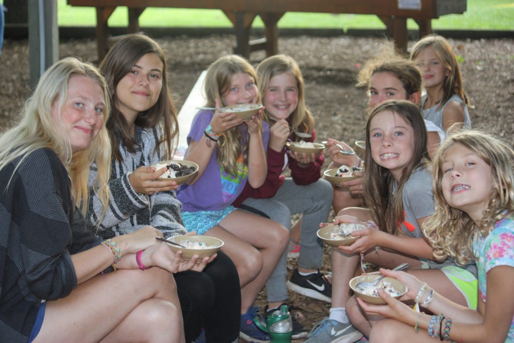 Children learning about farm-to-table experiences at summer camp