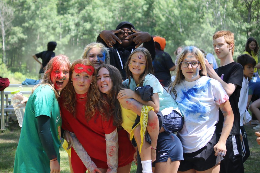 Diverse group of campers enjoying outdoor activities at a Minnesota summer camp