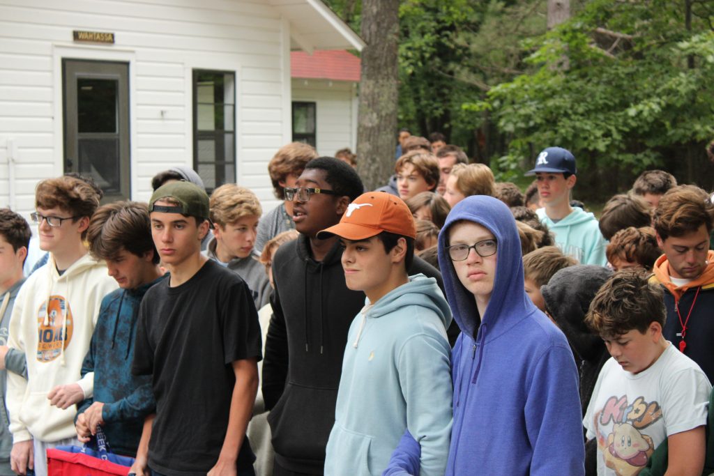 Diverse group of campers participating in community building activities