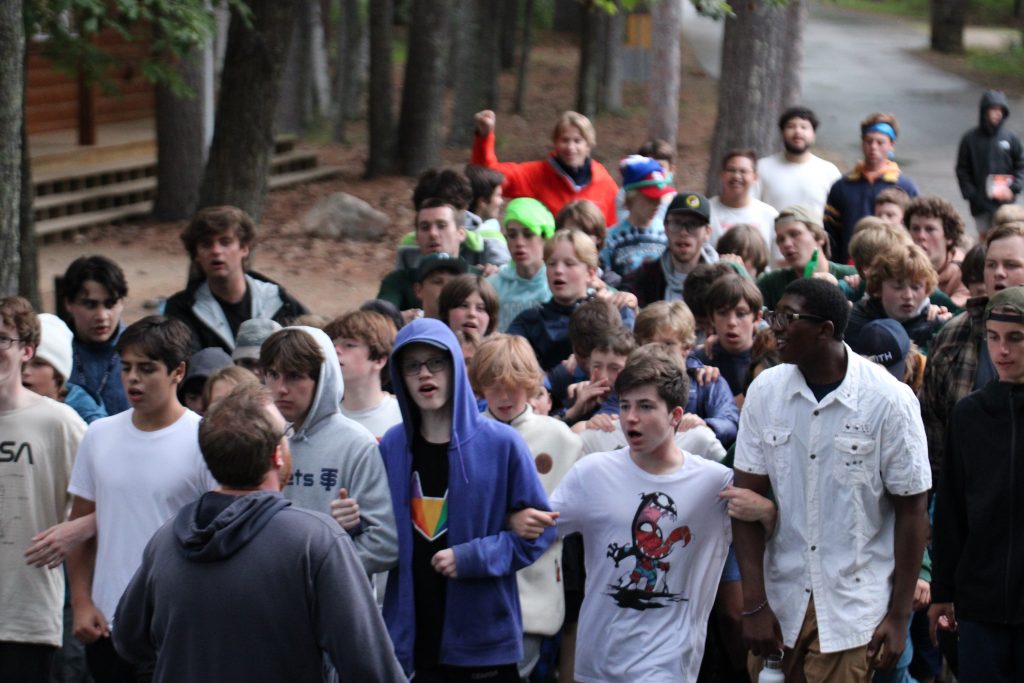 boy campers marching through the center of Camp Foley 