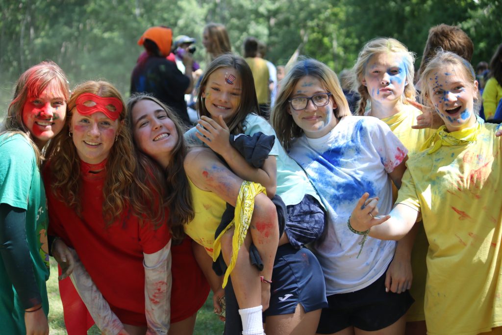 Group of teens laughing and bonding at camp