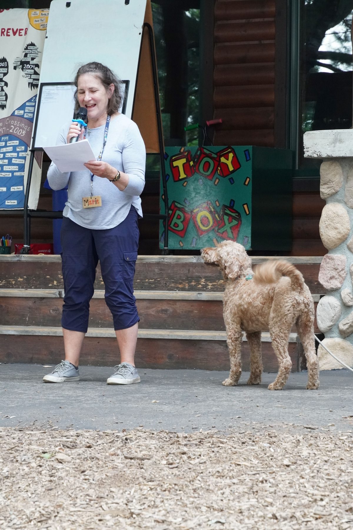 A woman reads a speech in front of Foley dining hall 