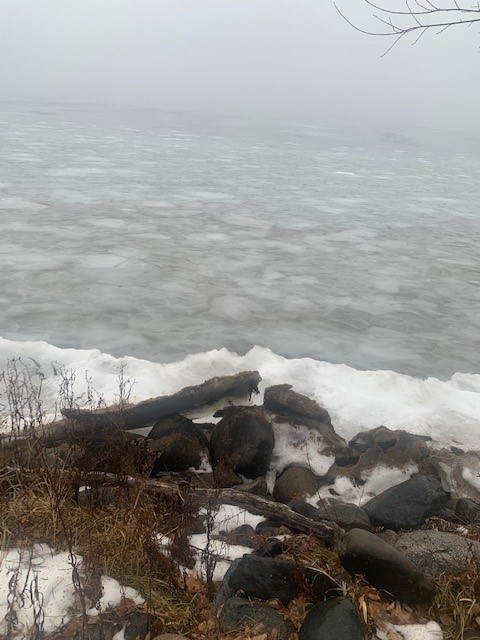 An ice ridge pushes up over the bank of Whitefish Lake at Camp Foley 